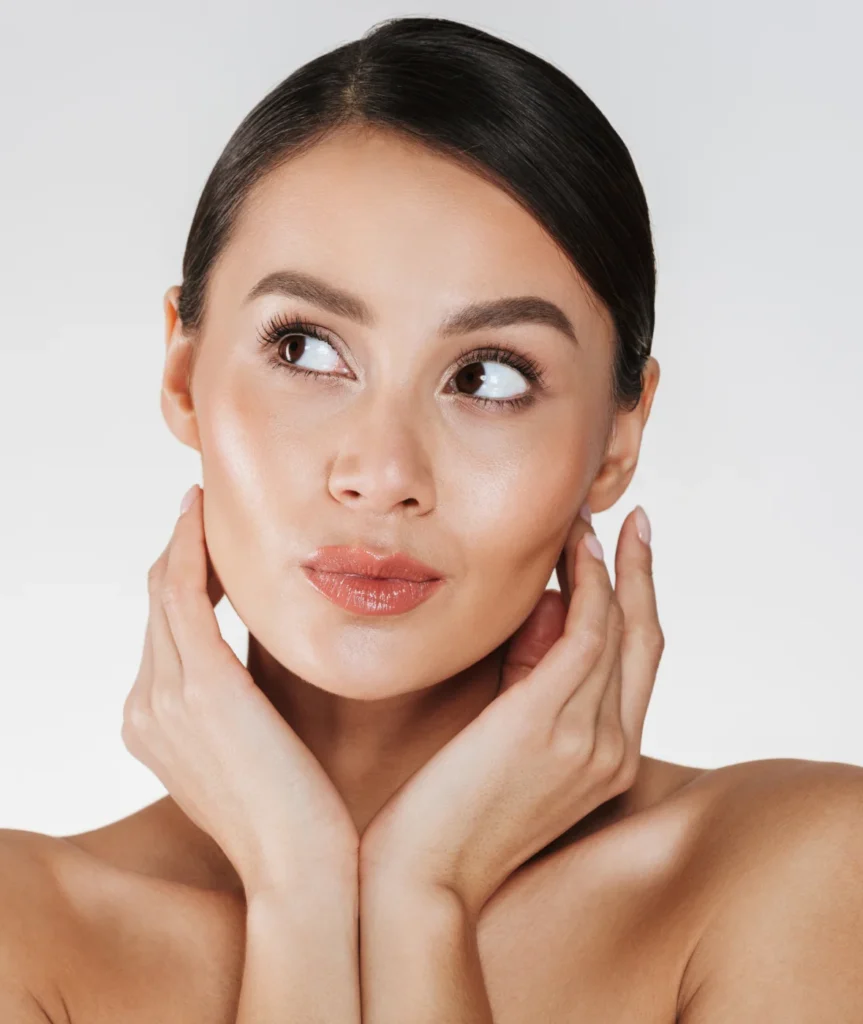 Close-up of woman with glowing skin after facial treatment at Two Chicks Aesthetics in Port Jefferson NY