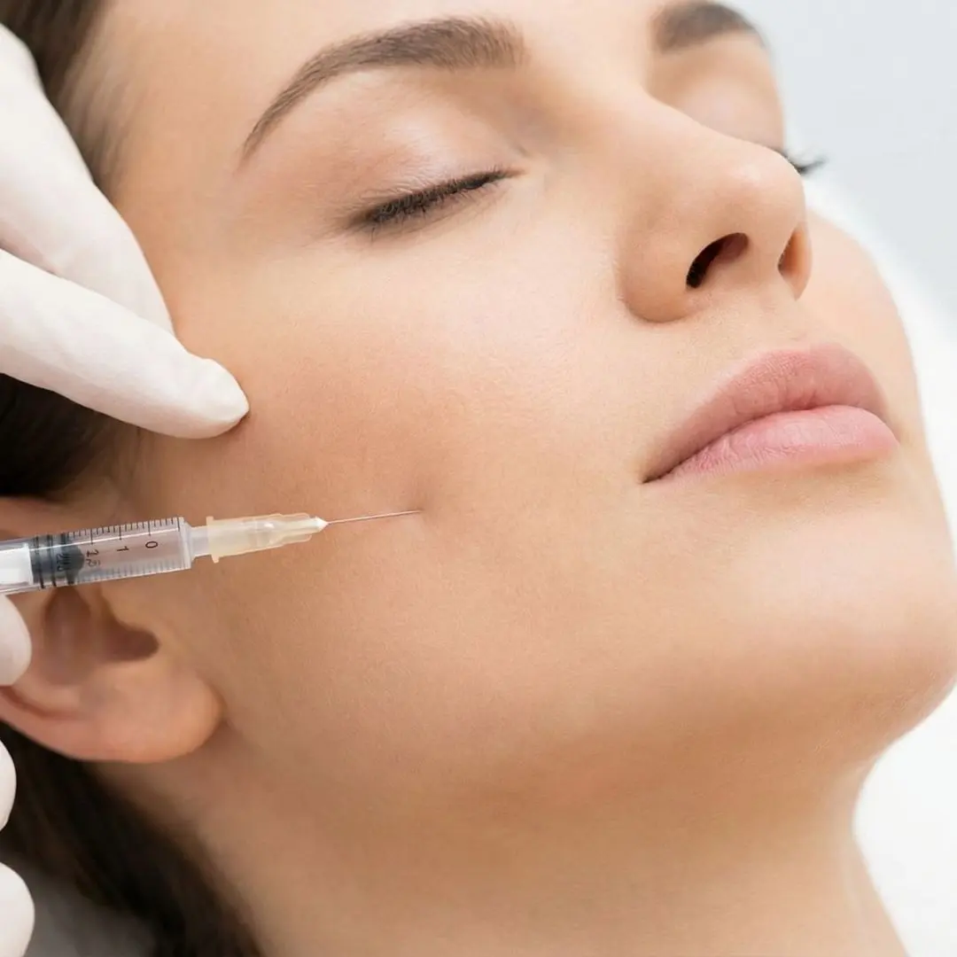 Personalized Botox Service in Port Jefferson — Expert care for natural-looking results 1 Botox Service: Close-up of a nurse practitioner administering a Botox injection directly into the masseter muscle for jaw reduction and teeth grinding relief.